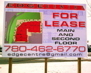 Billboard signage announcing leasing opportunities