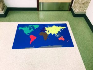 World map floor signage