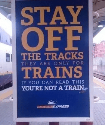 Humorous train station sign