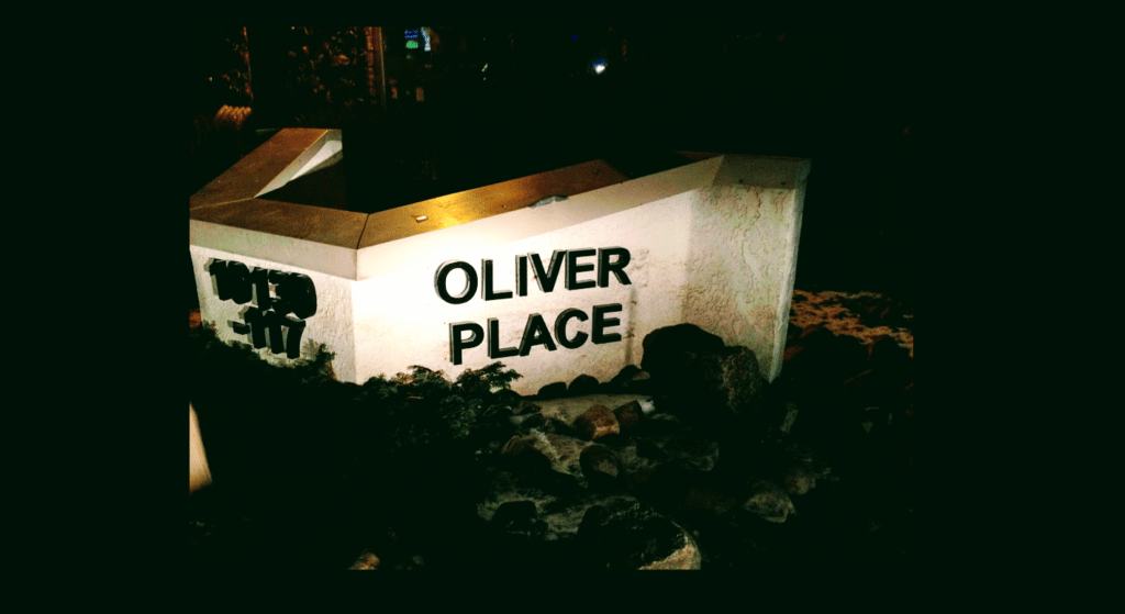 Oliver Place sign at night